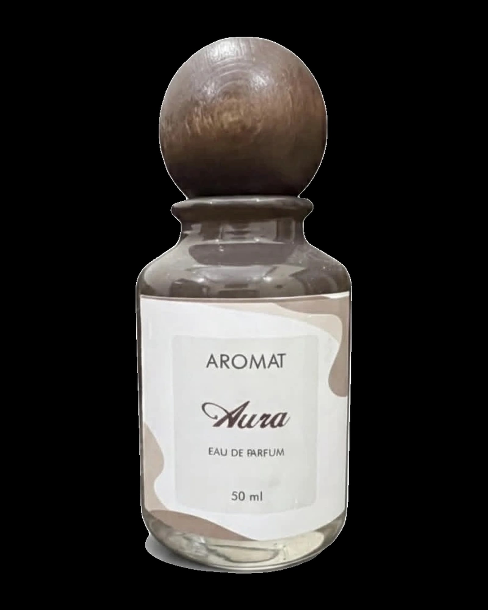 A clear glass perfume bottle filled with light liquid, featuring a smooth, round dark wooden cap. The body has a white label with subtle nude and tan organic abstract shapes. The text on the label reads "AROMAT" at the top in sans-serif uppercase, "Aura" in a cursive script font in the center, follo